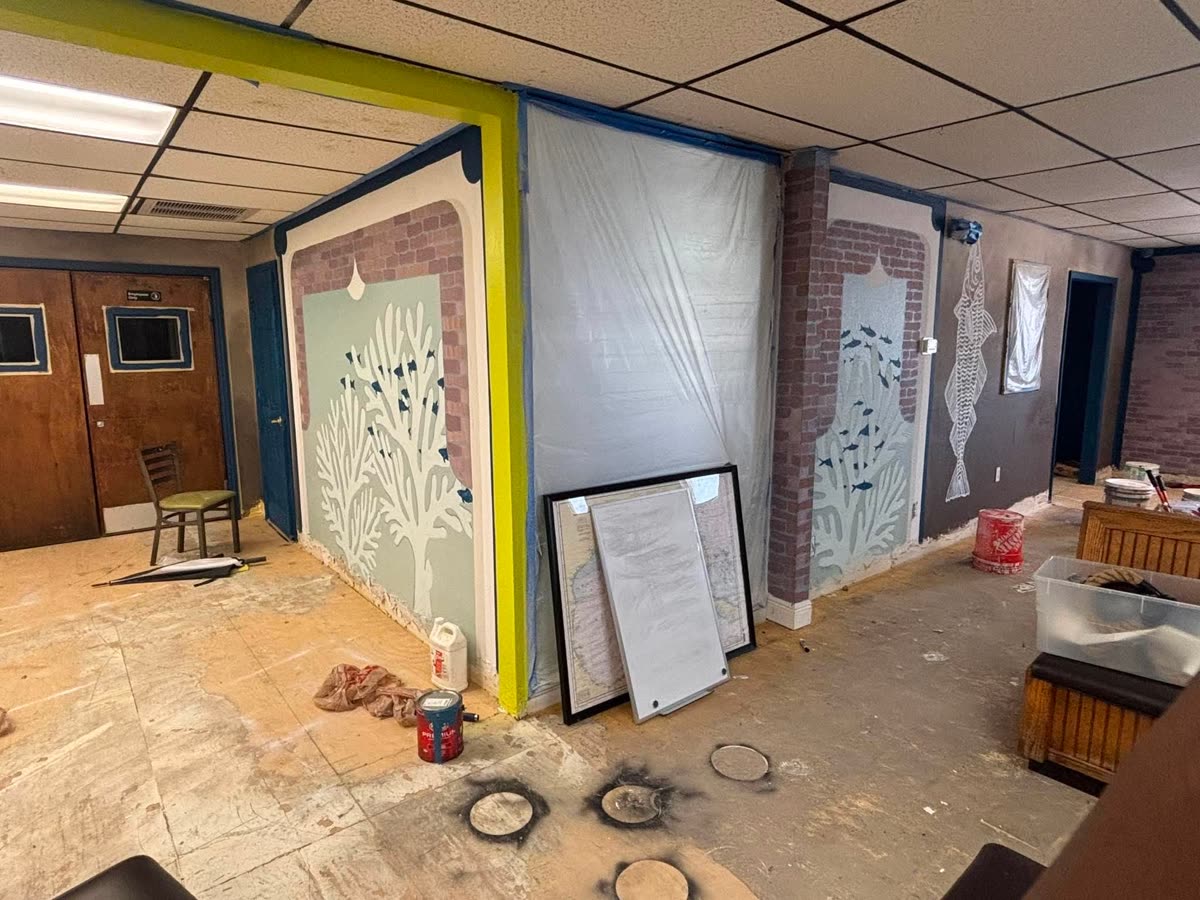 Renovation in progress — coral murals going up on the dining room walls